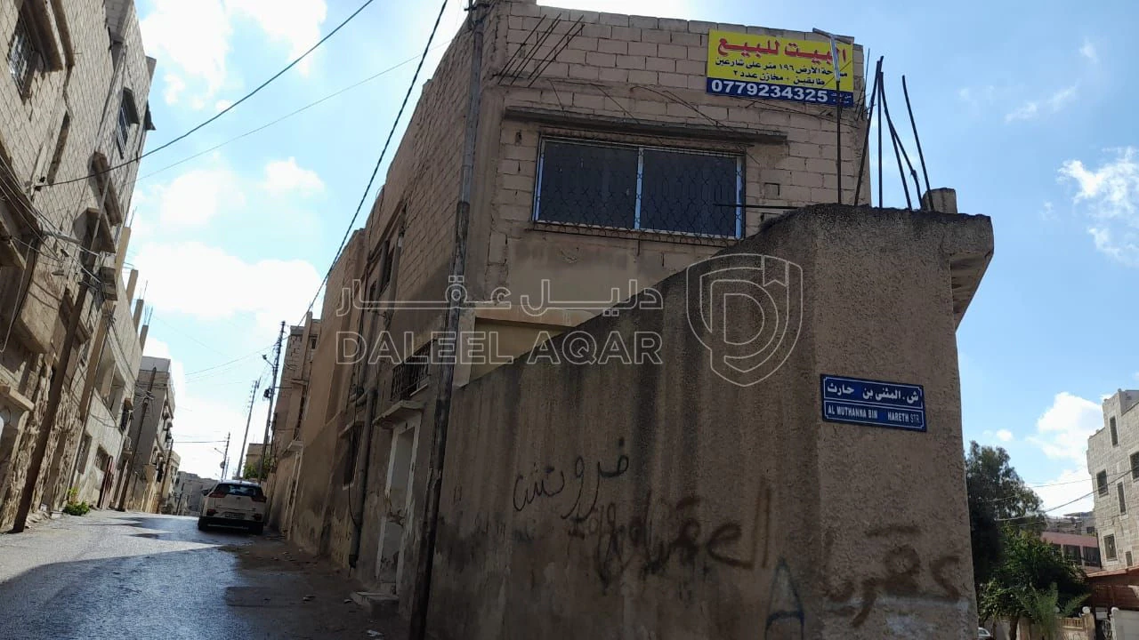 مبنى في الزرقاء - حي شاكر - قرب مدرسة عائشة - 28,000 دأ - صورة 1