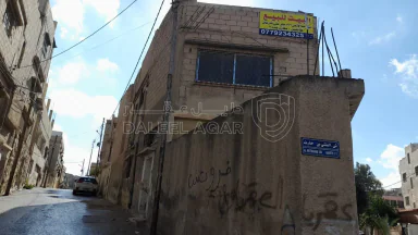 مبنى في الزرقاء - حي شاكر - قرب مدرسة عائشة - 28,000 دأ - صورة NaN