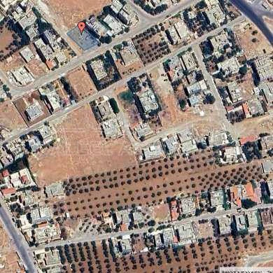 أرض في قطعة ارض واجهتين على الشارع في خريبة السوق  - 48,000 دأ - صورة 1