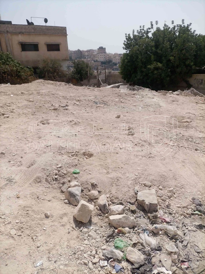 أرض في حي النصر،بالقرب من مسجد الفلاح - 25,000 دأ - صورة 1