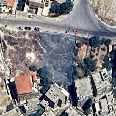 أرض في جبل الحديد بجانب بيت الشيخ برجس الحديد - 85,000 دأ - صورة 1