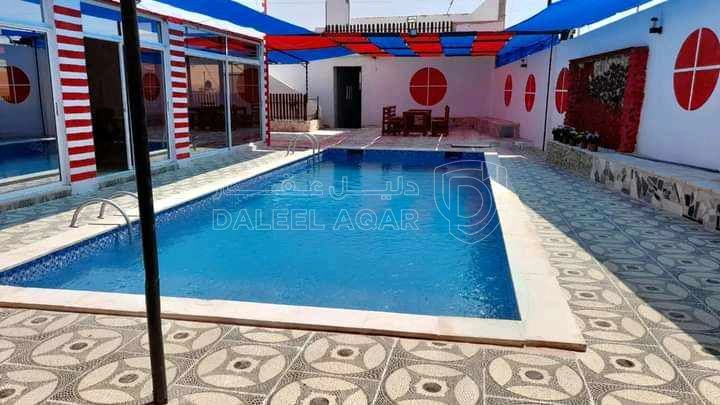 مبنى في مزرعة وشاليه للبيع في بلعما الزيتونه مساحة 3.459 - 85,000 دأ - صورة 1