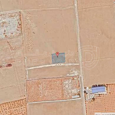 أرض في قبل جسر المطار ب 2 كم - 72,500 دأ - صورة 1