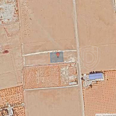 أرض في قبل جسر المطار ب 2 كم - 77,000 دأ - صورة 1