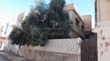 مبنى - الزرقاء - حي شاكر - قرب مدرسة عائشة - 28000 دأ