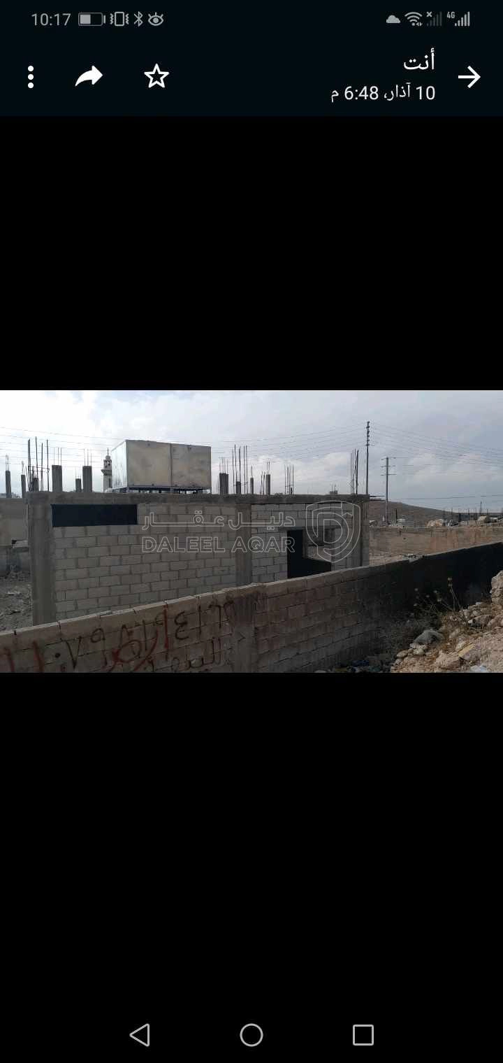 أرض في المغيرات المريزقه بجانب المسجد الإبراهيمي محاطه بسور وعليها بناء غير مكتمل - 30,000 دأ - صورة 1