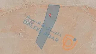 أرض في قرية أم الوليد بالقرب من محطة توليد الكهرباء - 25,000 دأ - صورة 1