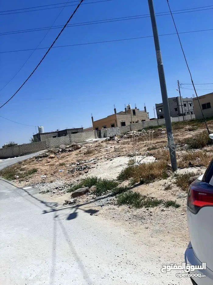 أرض في الهاشمية الزرقاء الاسكان حارة. العوايد - 18,000 دأ - صورة 1