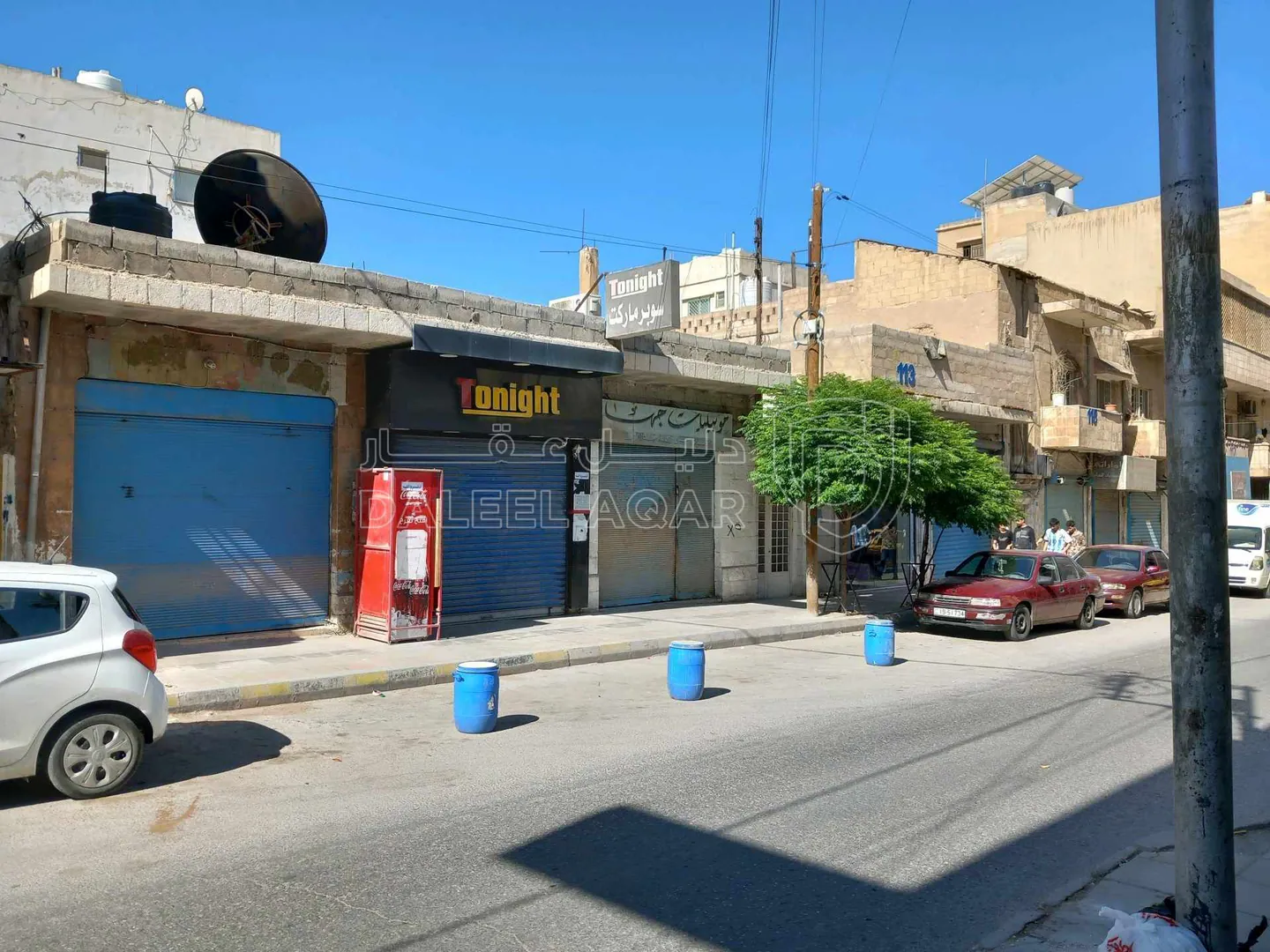 مبنى في الزرقاء وسط تجاري شارع الملك عبد الله - 100,000 دأ - صورة 1