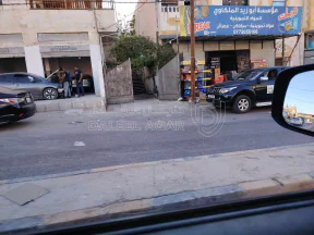 مبنى في اربد،حي الإيمان،شارع الشهداء،( شارع الجملة)  - 300,000 دأ - صورة NaN