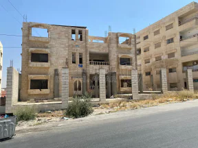 مبنى - الزرقاء الجديدة شارع 26 بجانب عمارة منير نشيوات - 700000 دأ