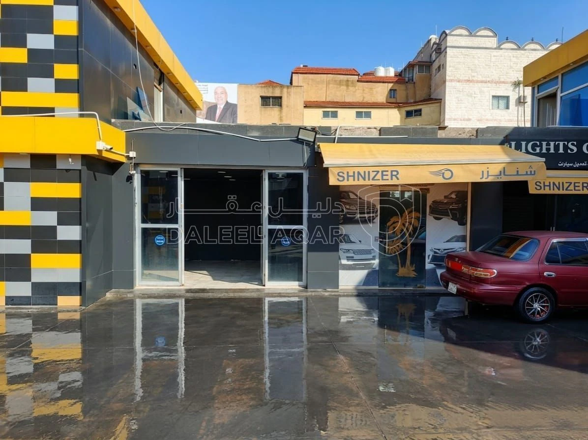 أرض في ارض تجارية للبيع مع محطة غسيل ومحلات للبيع  - 750,000 دأ - صورة 1