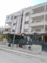شقة - ضاحيه الرشيد خلف مدارس المنهل  - 115000 دأ