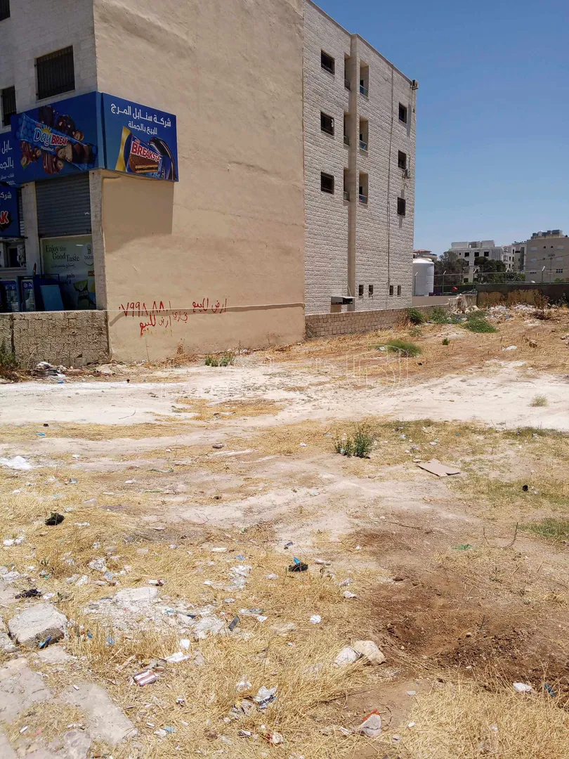 أرض في مرج الحمام 1112م تجاري طولي بسعر مغري - 570,000 دأ - صورة 1