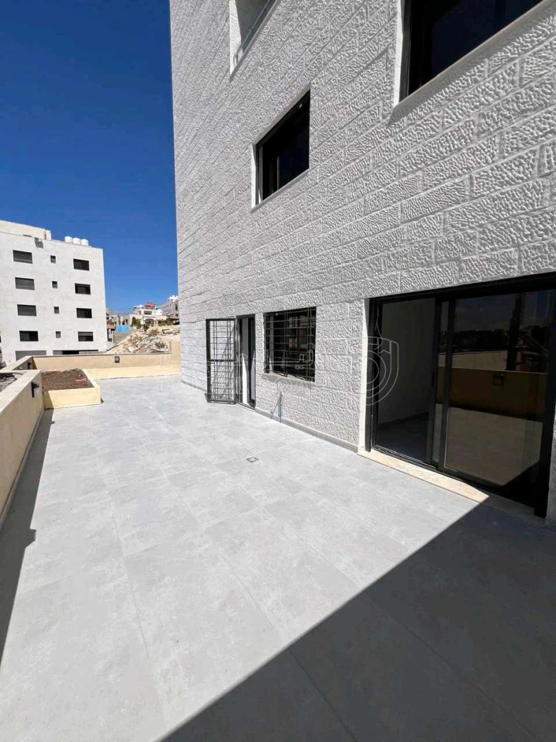 شقة في مقابل جامعة البتراء / طريق المطار / عميش - 79,000 دأ - صورة 1