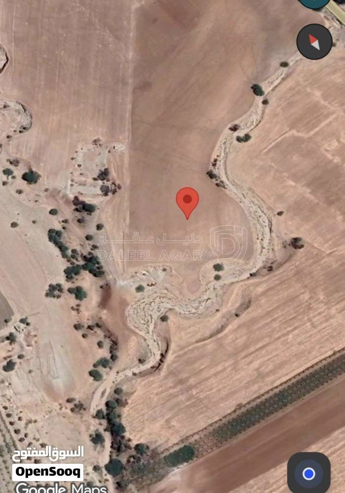 أرض في غور الوهادنة - 230,000 دأ - صورة 1