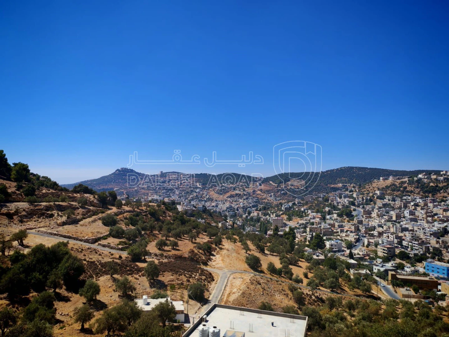 أرض في عجلون عين جنا - 70,000 دأ - صورة 1