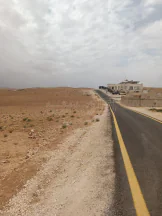 أرض في شارع عمان التنموي مقابل القصر القطري مباشرة  - 55,500 دأ - صورة NaN