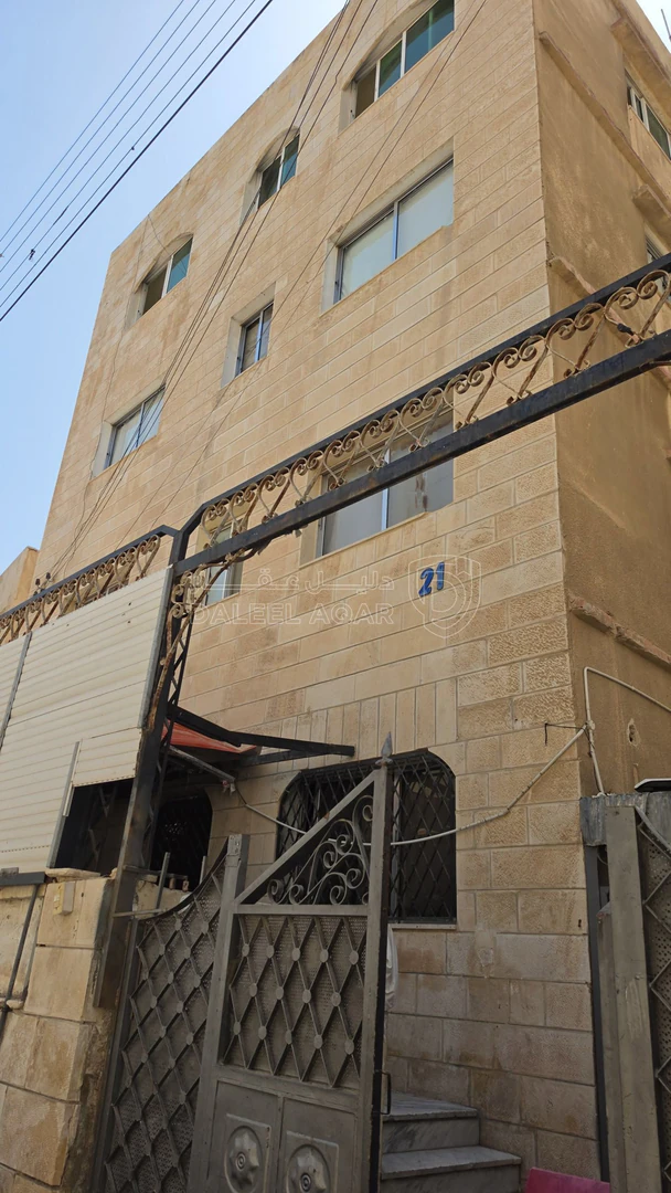 مبنى في عماره للبيع بسعر 100 الف( 8 شقق ) مآجره 900 د شهري - 100,000 دأ - صورة 1