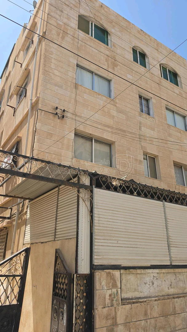 مبنى في عماره للبيع بسعر 100 الف( 8 شقق ) مآجره 900 د شهري - 100,000 دأ - صورة 1