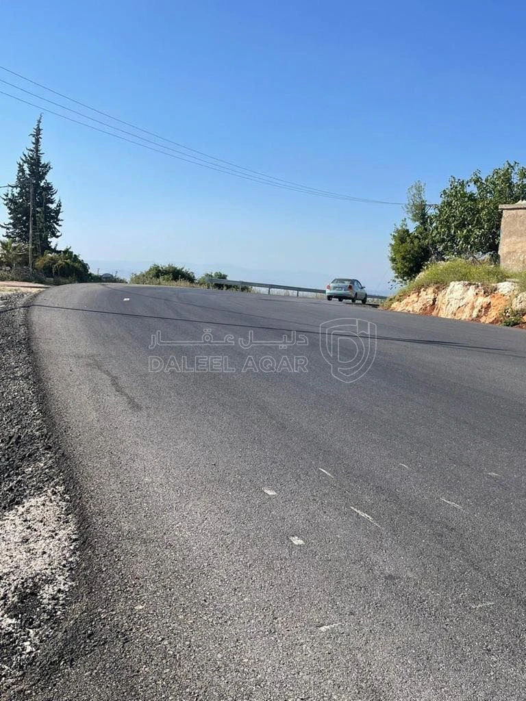 أرض في عجلون دير صماديه - 125,000 دأ - صورة 1