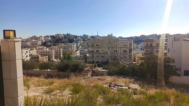 أرض في البنيات بالقرب  من السوق التجاري - 105,000 دأ - صورة NaN