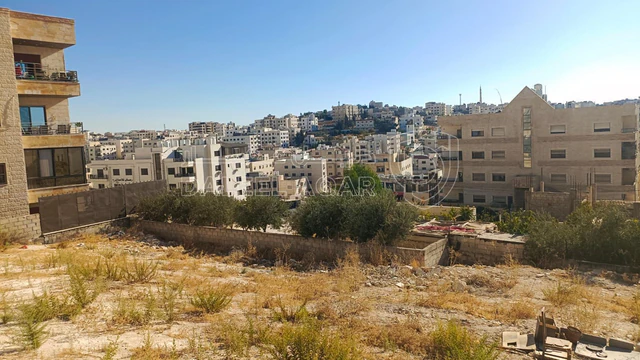 أرض - البنيات بالقرب  من السوق التجاري - 105000 دأ