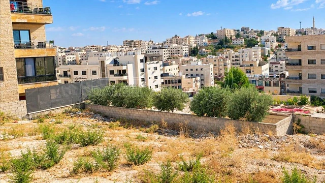 أرض - البنيات بالقرب  من السوق التجاري - 105000 دأ
