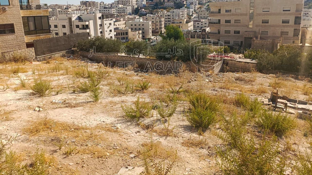 أرض في البنيات بالقرب  من السوق التجاري - 105,000 دأ - صورة NaN