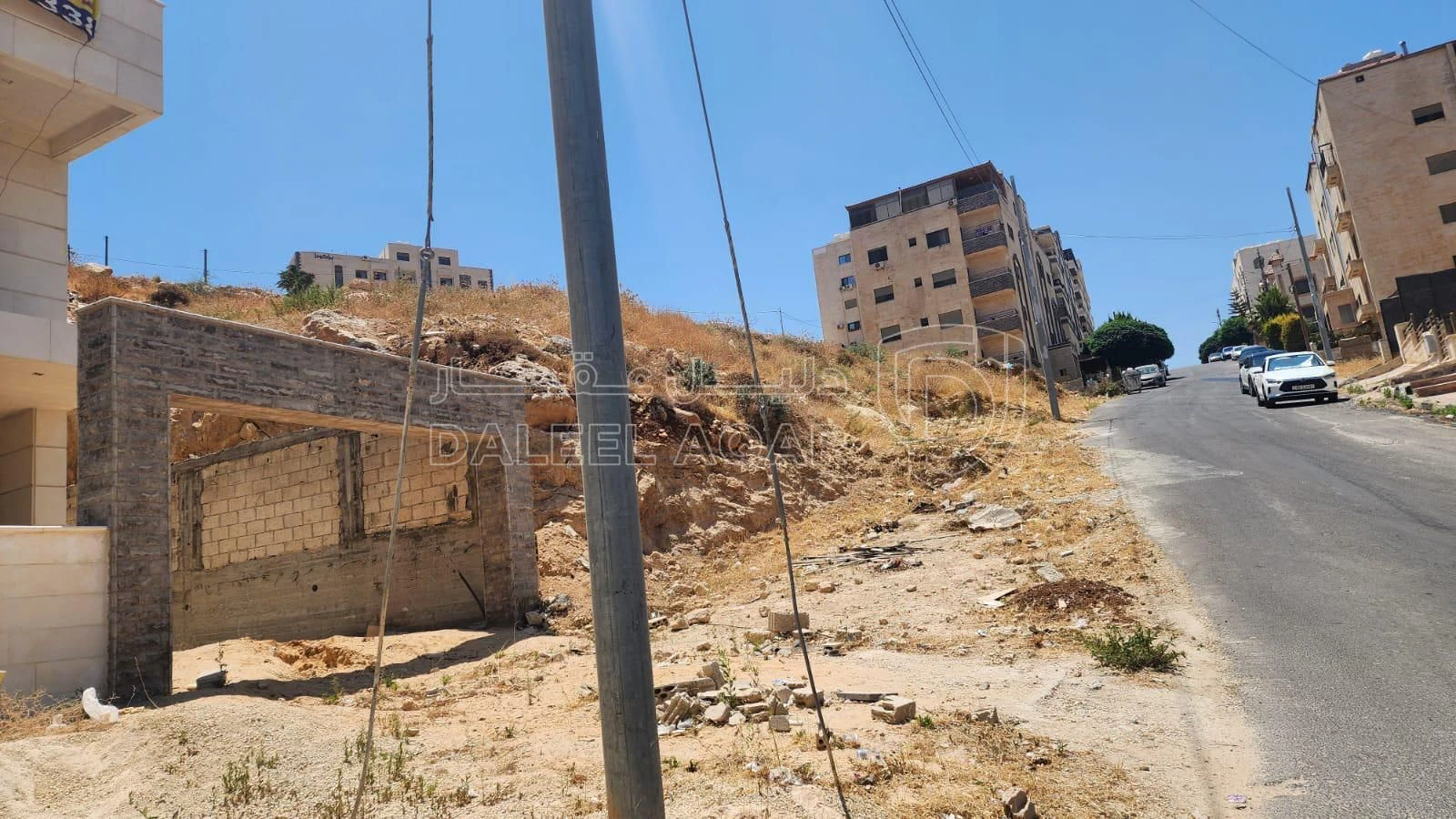 أرض في ارض بمنطقة ابونصير ام بطمة 8 على شارع الاردن - 125,000 دأ - صورة 1