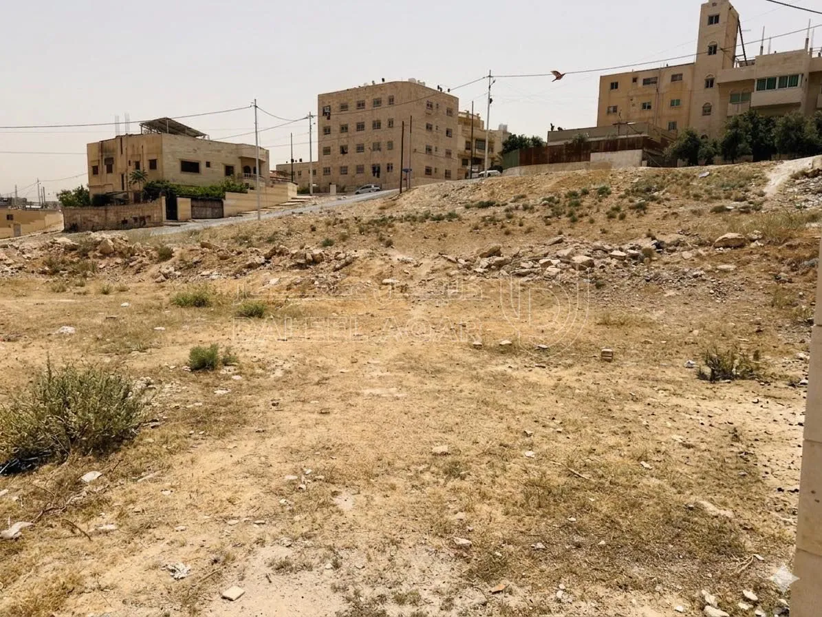 أرض في أرض 1000م بالرصيفة النقب قرب البيبسي قطعة - 94,000 دأ - صورة 1