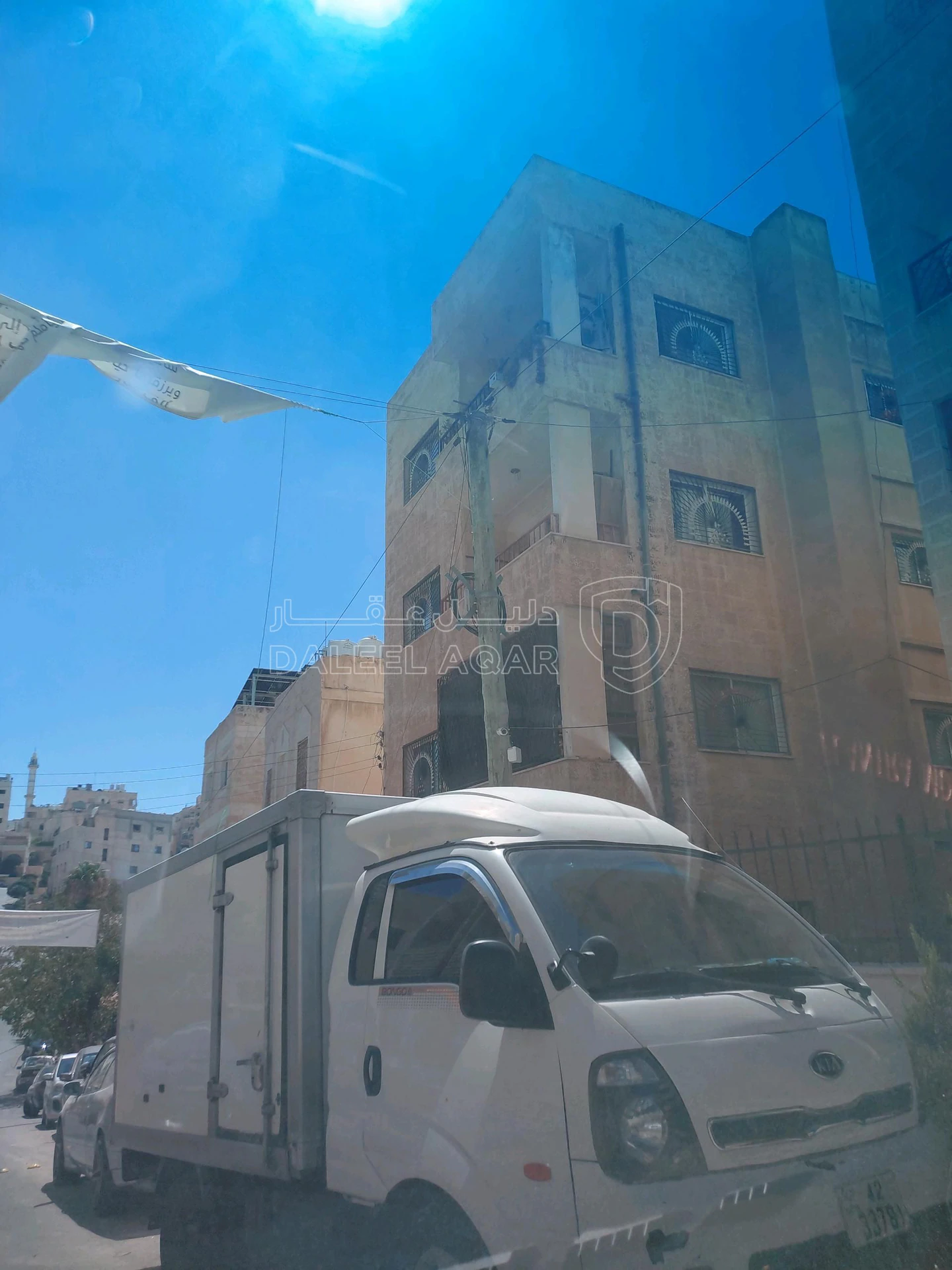 مبنى في الذراع الغربي شارع الفراهيدي - 250,000 دأ - صورة 1