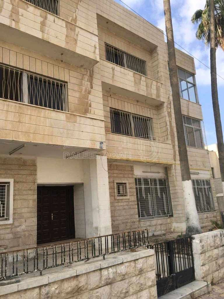 مبنى في عماره سكنية للبيع قريبه من الدوار الثالث  - 500,000 دأ - صورة 1