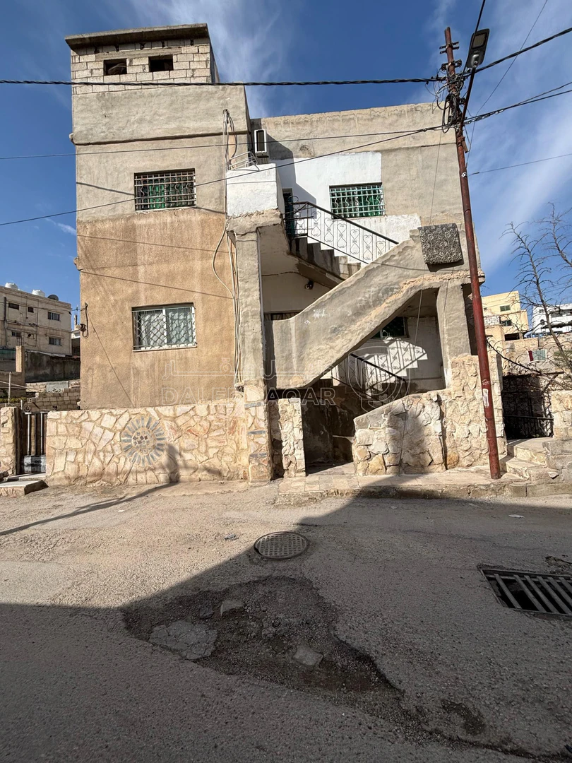 مبنى في الزرقاء-الزواهرة بالقرب من دوار الدلة - 45,000 دأ - صورة 1