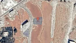 أرض في اراضي ناعور - ام البساتين  - 100,000 دأ - صورة 1