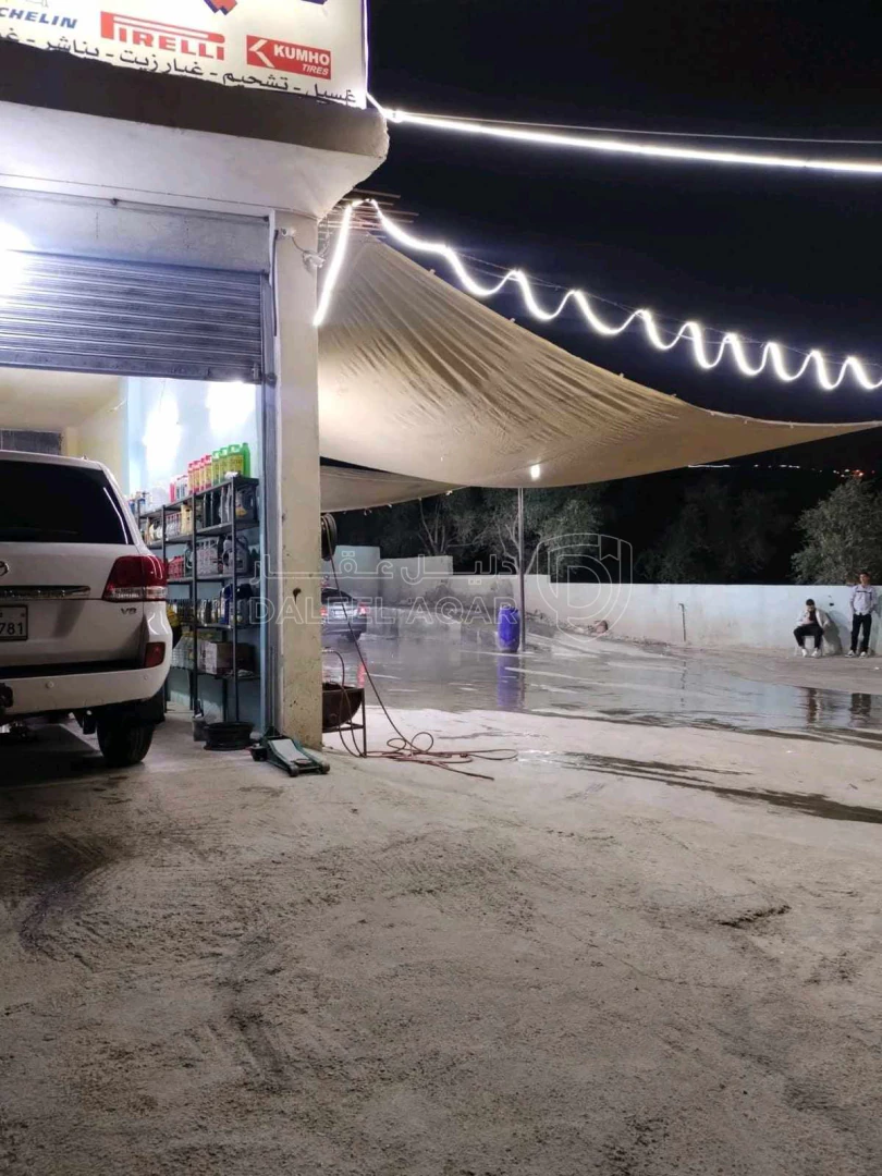 أرض في محطه غسيل سيارات للبيع مع الأرض تجاريه  - 95,000 دأ - صورة 1