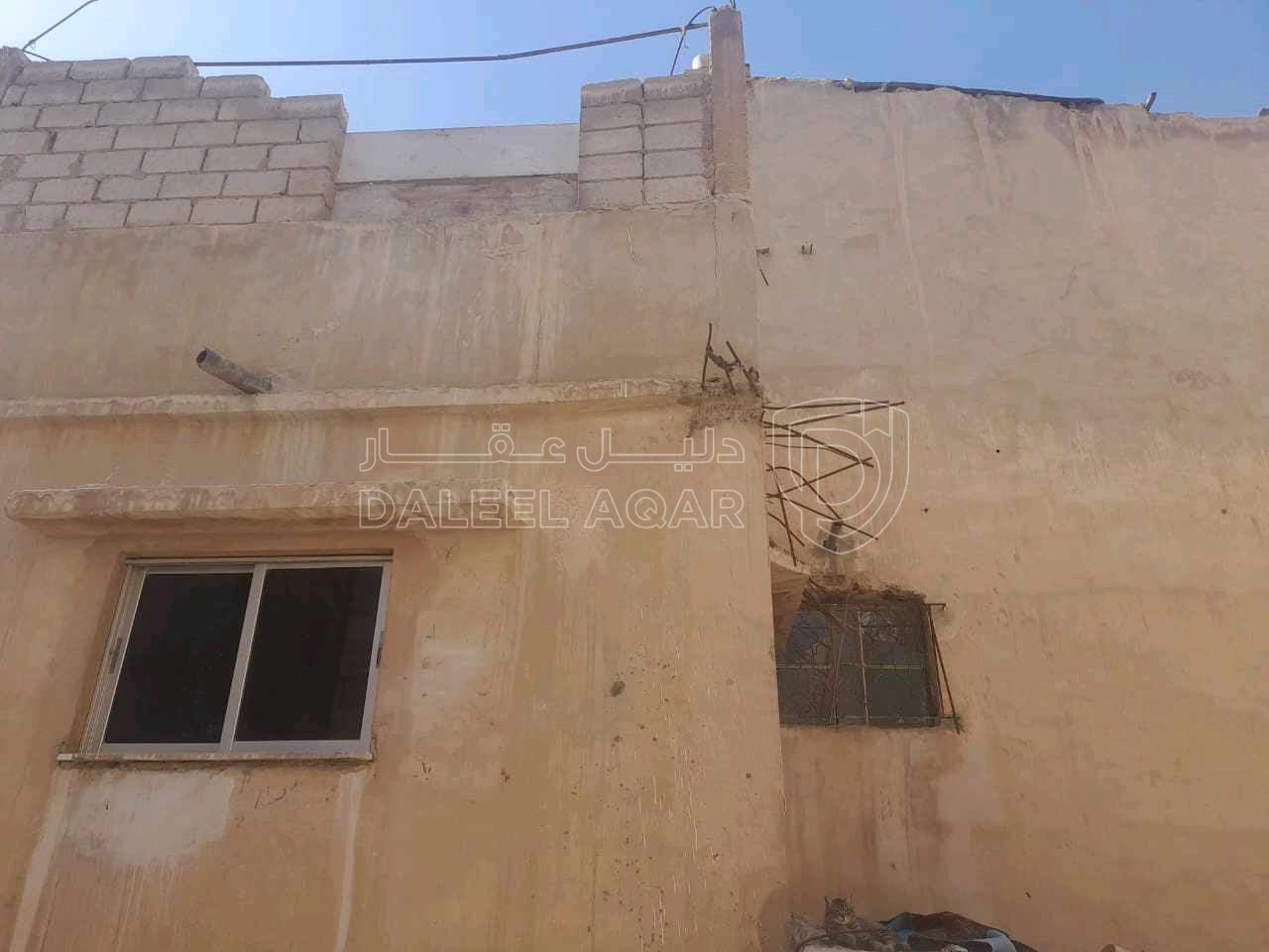 مبنى في الزرقا حي معصوم على نزول مدرسة حي رمزي - 20,000 دأ - صورة 1