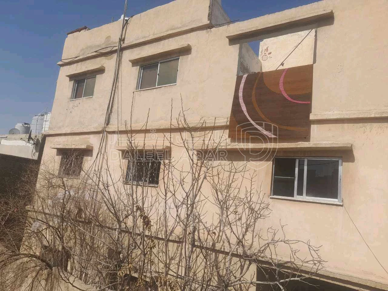 مبنى في الزرقا حي معصوم على نزول مدرسة حي رمزي - 20,000 دأ - صورة 1