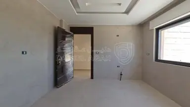 شقة في روف طابقي طريق المطار الحويطي خلف لمدارس العالمية  - 250,000 دأ - صورة NaN