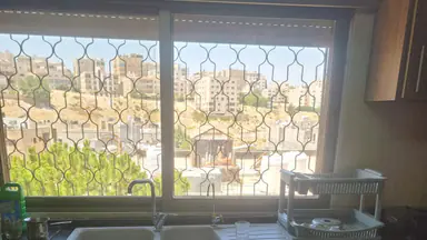شقة في شقه في ضاحيه الرشيد 295م مع روف للبيع  - 100,000 دأ - صورة NaN