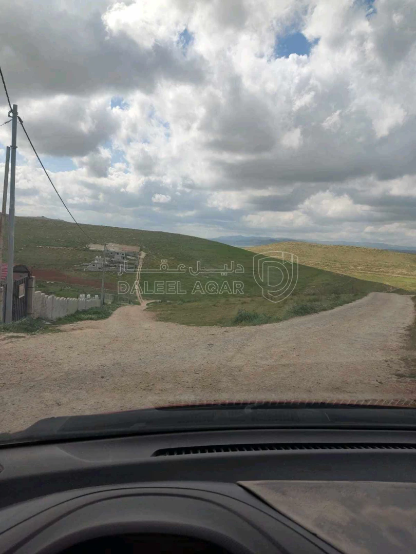 أرض في بلعما قرية حمنانه غرب مدرسة البستانة - 20,000 دأ - صورة 1