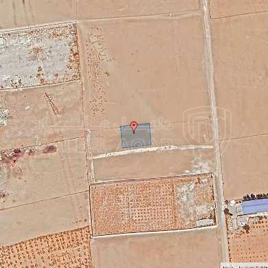 أرض في قبل جسر المطار ب 2 كم - 72,500 دأ - صورة 1