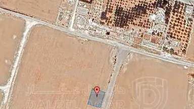 أرض في قرية الصلاحية - امتداد طريق المطار - 27,500 دأ - صورة NaN