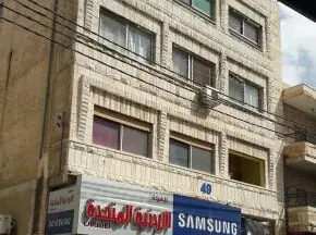 مبنى - الزرقاء حي السعاده تقاطع شارع باب الواد  - 220000 دأ