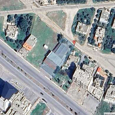 أرض في اربد-شارع البترا - 550,000 دأ - صورة 1